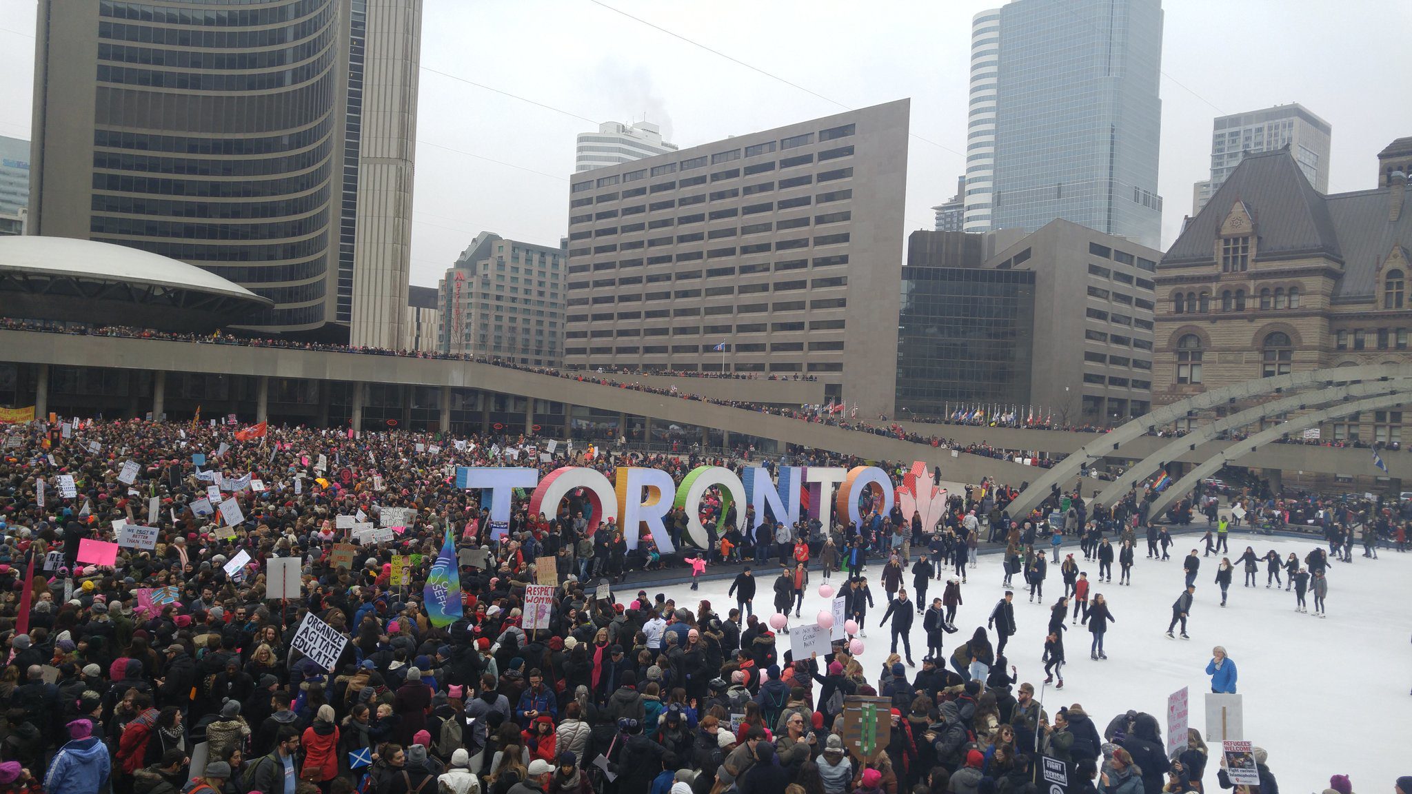 The Toronto Women's March on Washington assembles in Nathan Phillips Square. Image courtesy H.G. Watson.